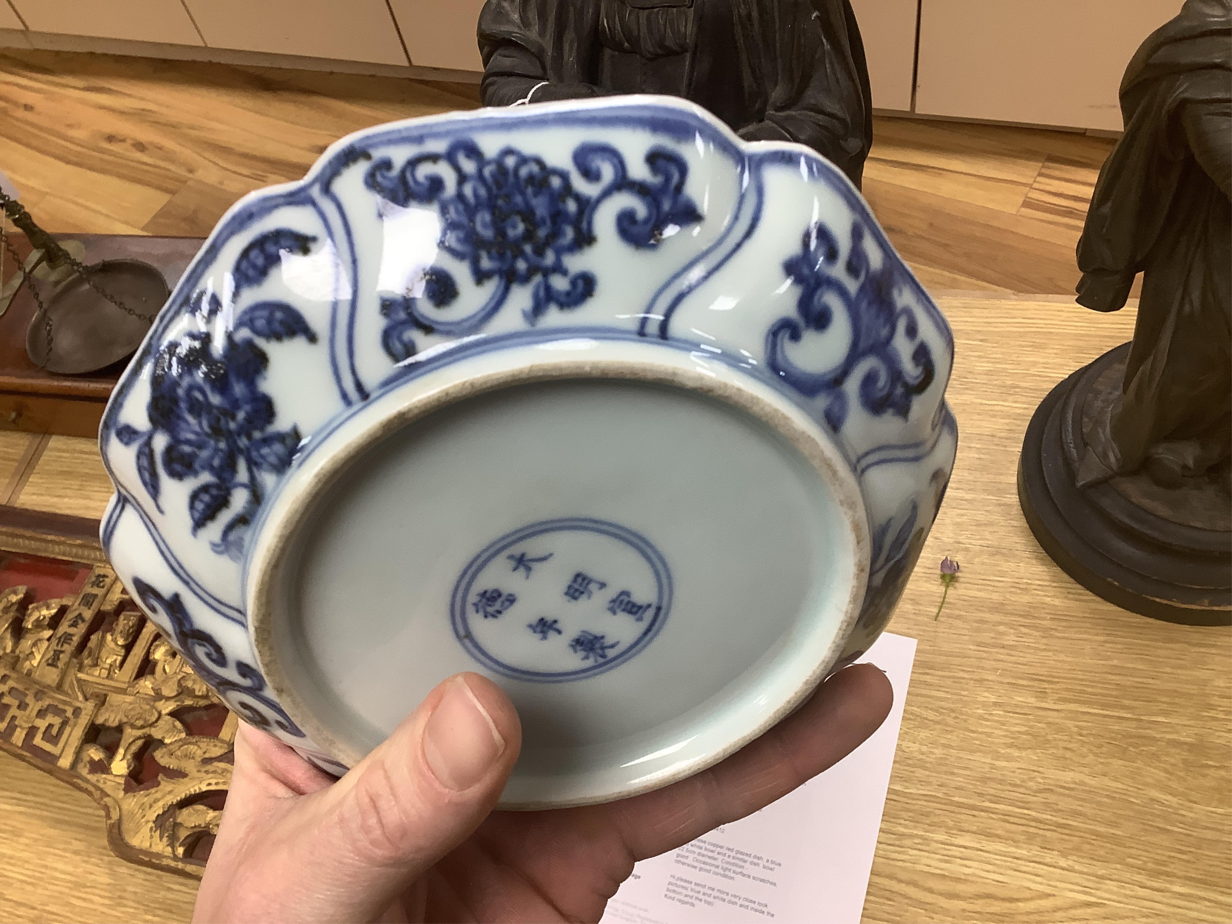 A Chinese copper red glazed dish, a blue and white bowl and a similar dish, bowl 22.5cm diameter. Condition - good